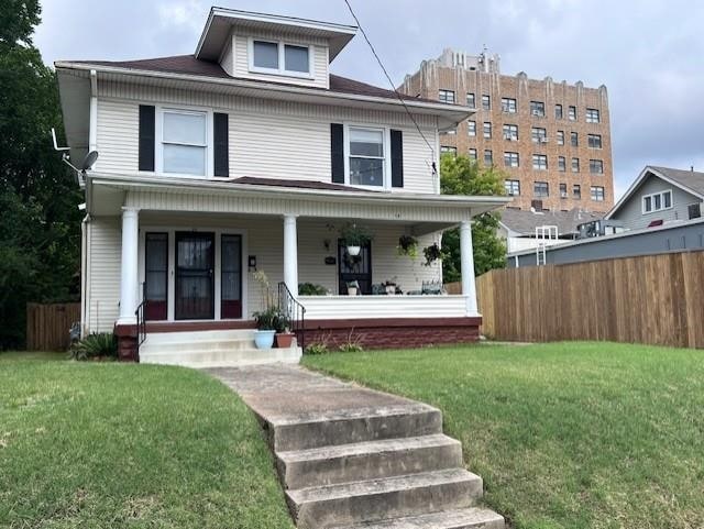 view of front of house featuring a porch and a front yard