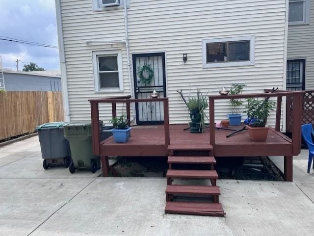 back of house featuring a patio area and a wooden deck