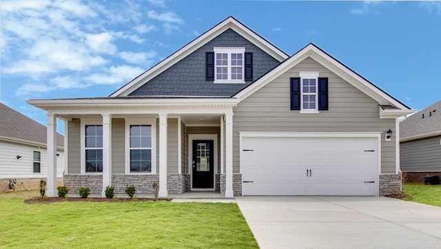 craftsman-style home with a garage and a front lawn