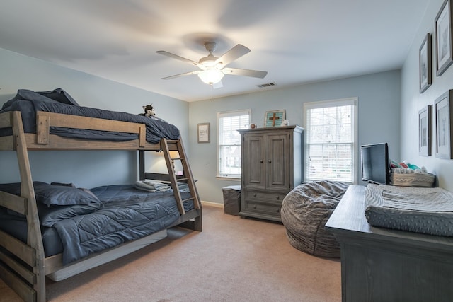 bedroom featuring ceiling fan and light colored carpet