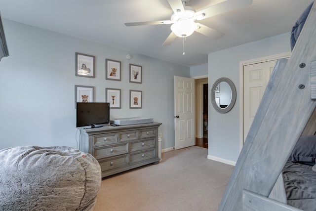 carpeted bedroom featuring ceiling fan