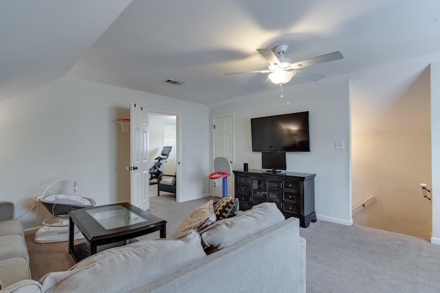 carpeted living room featuring ceiling fan and vaulted ceiling