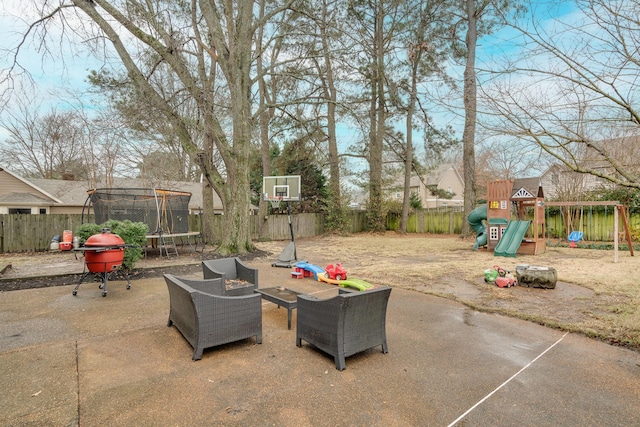 view of patio / terrace with a trampoline and a playground