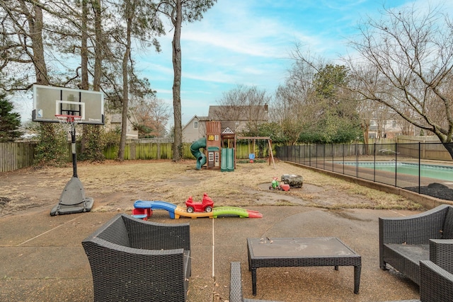 view of play area with a fenced in pool