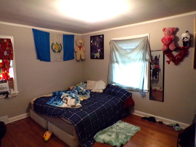 bedroom with dark wood-type flooring