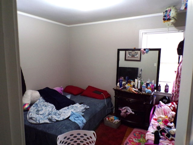 bedroom featuring crown molding