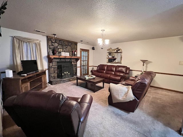 living room with a fireplace, carpet, a chandelier, and a textured ceiling