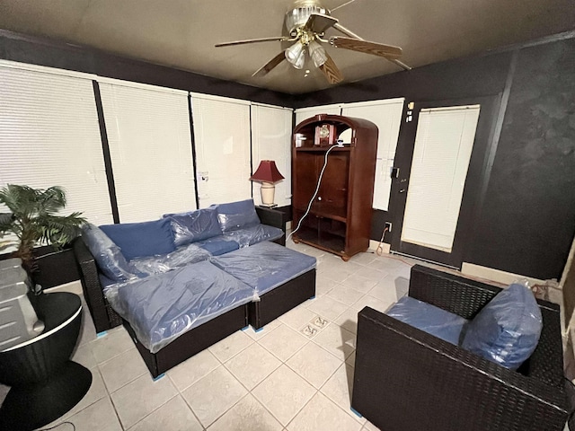 tiled living room featuring ceiling fan