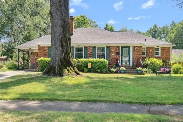 ranch-style home featuring a front yard and a carport