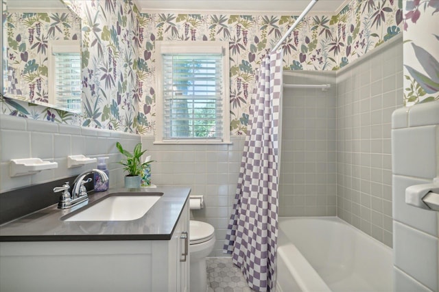 full bathroom featuring shower / tub combo with curtain, vanity, ornamental molding, and toilet