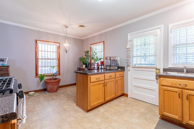 kitchen featuring kitchen peninsula, decorative light fixtures, stainless steel range with gas cooktop, and a wealth of natural light