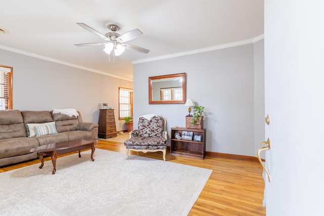 living room with ceiling fan, wood-type flooring, and ornamental molding