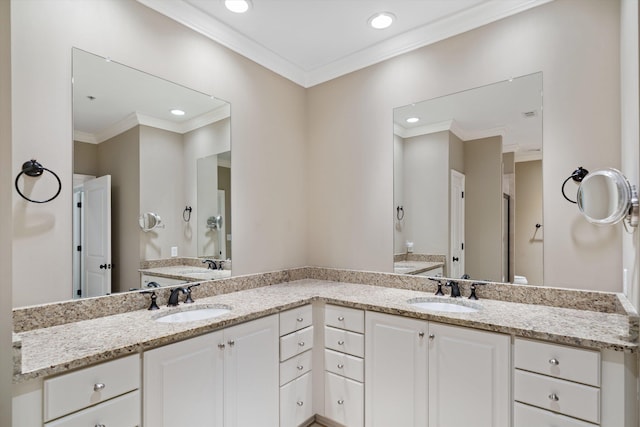 bathroom with vanity and ornamental molding