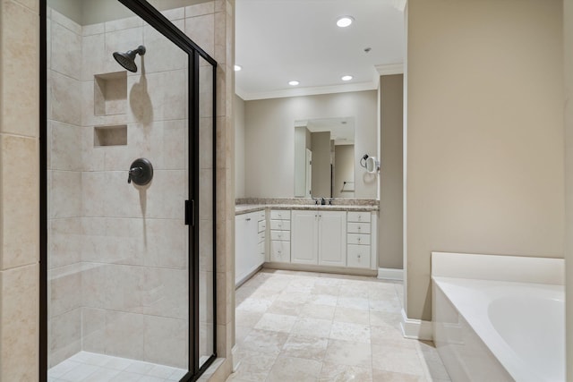 bathroom with crown molding, vanity, and shower with separate bathtub