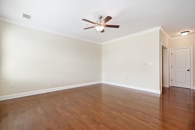 empty room with ceiling fan, dark hardwood / wood-style flooring, and crown molding