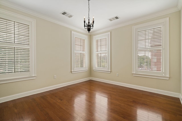 spare room featuring a notable chandelier, dark hardwood / wood-style floors, and crown molding