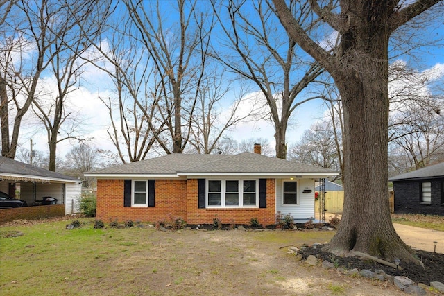 ranch-style house with a front lawn