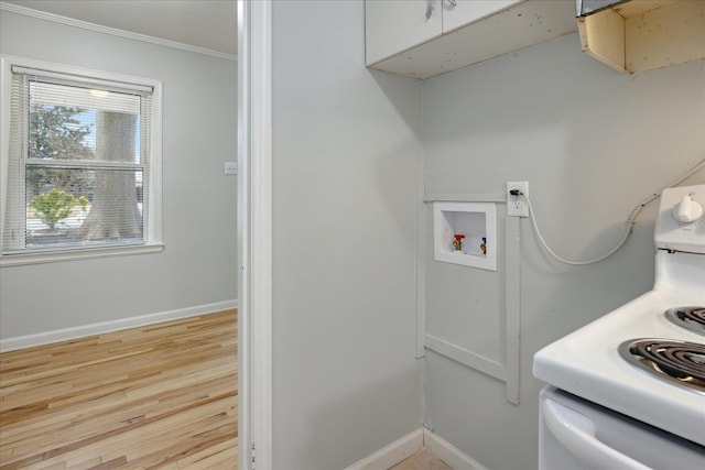 laundry room featuring ornamental molding, hookup for a washing machine, and light hardwood / wood-style flooring