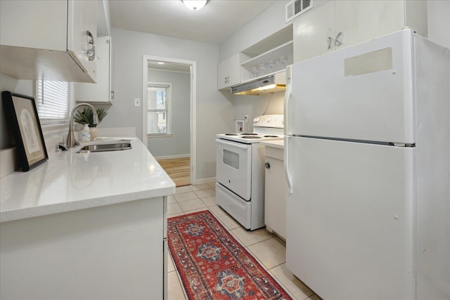 kitchen featuring white cabinetry, sink, range hood, white appliances, and light tile patterned floors