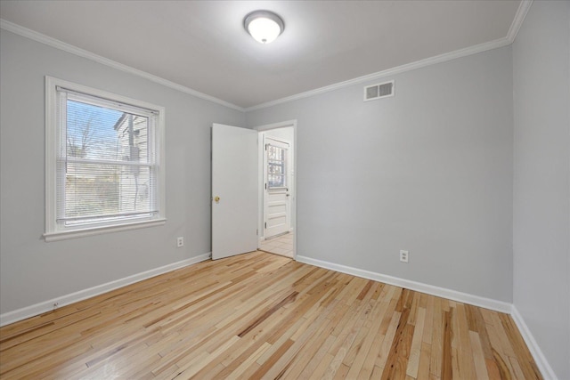 unfurnished bedroom with light wood-type flooring and ornamental molding