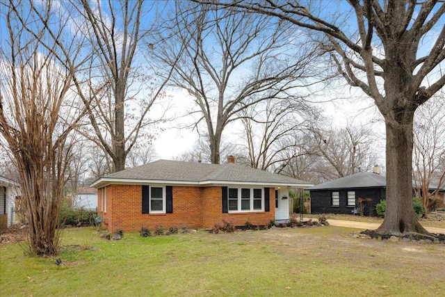 ranch-style home featuring a front yard