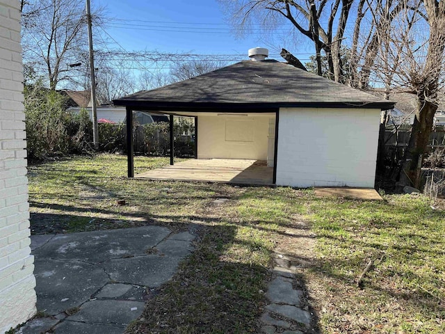 view of outbuilding with a lawn