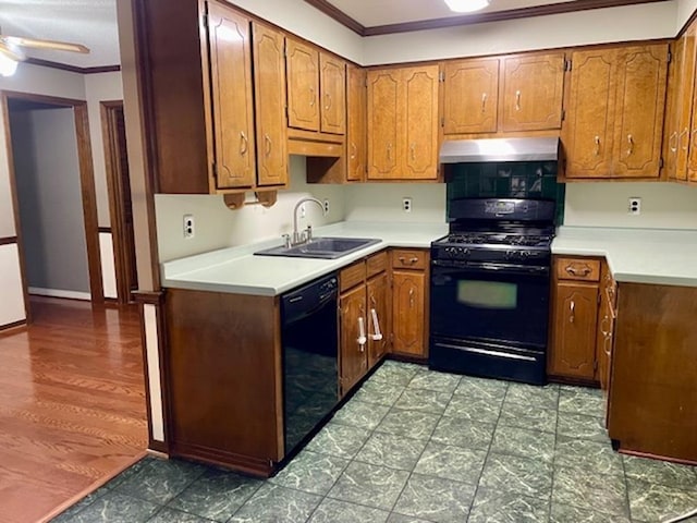 kitchen with ceiling fan, sink, black appliances, and ornamental molding