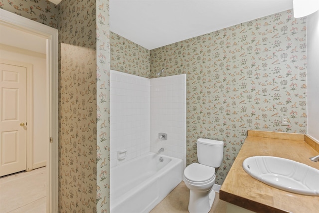 full bathroom featuring vanity, toilet, and tiled shower / bath combo