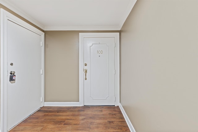 entryway featuring dark hardwood / wood-style flooring and ornamental molding