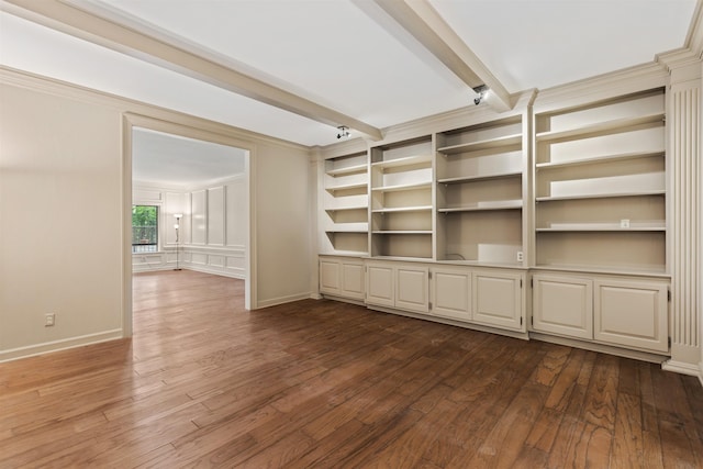 unfurnished living room with dark hardwood / wood-style floors and beam ceiling