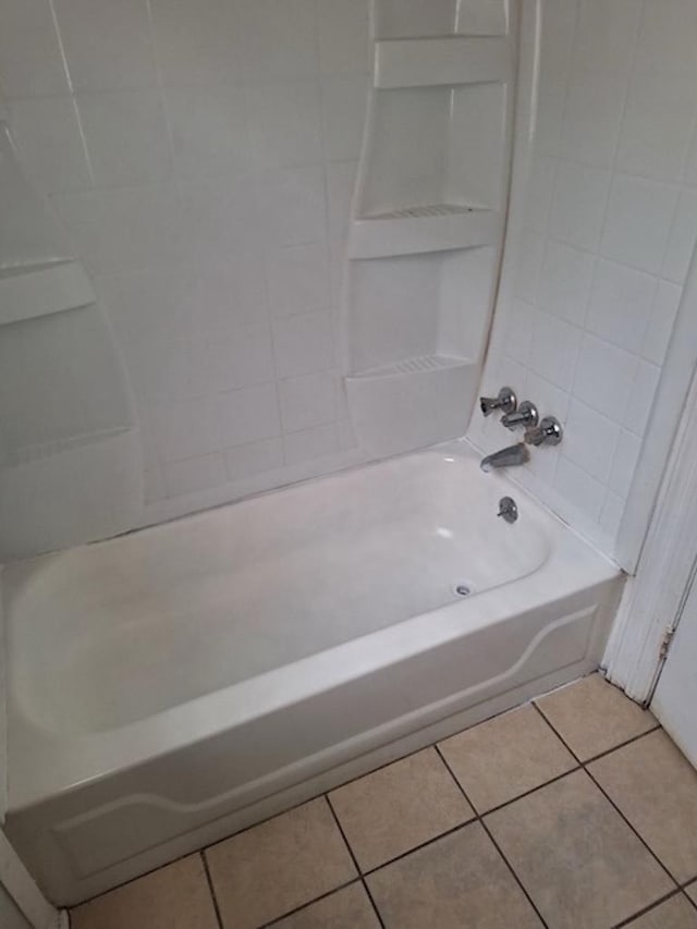 bathroom with bathing tub / shower combination and tile patterned flooring