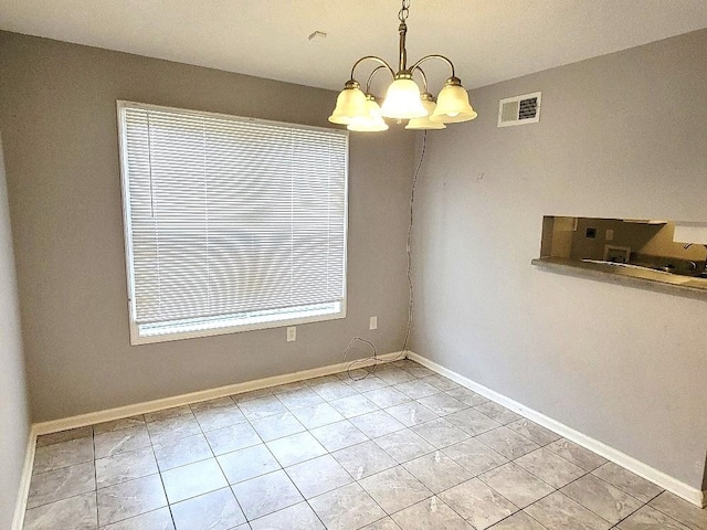 unfurnished dining area featuring light tile patterned floors and an inviting chandelier