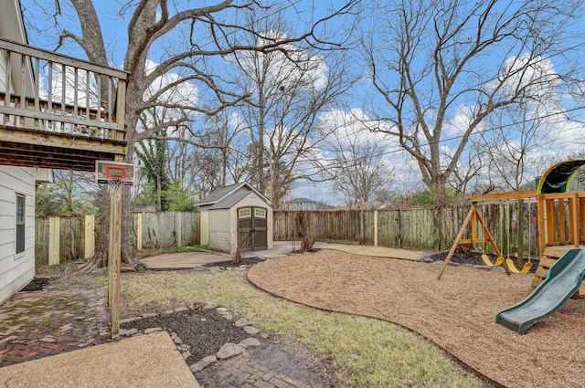 view of yard with a playground and a storage shed