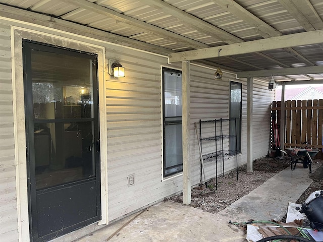 doorway to property with fence