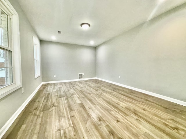 empty room with wood-type flooring