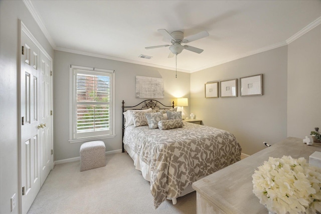 bedroom with ceiling fan, light colored carpet, and ornamental molding