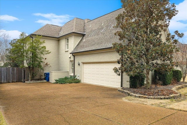 view of side of property with a garage