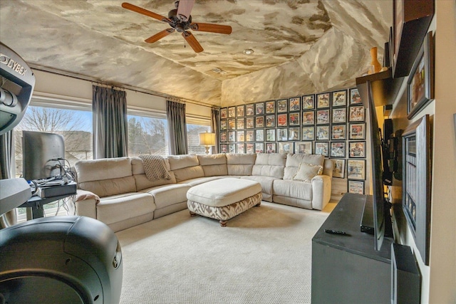 living room featuring ceiling fan and carpet floors