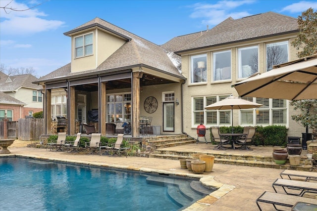 rear view of house featuring a patio area