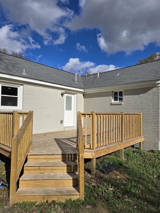 back of house with a wooden deck