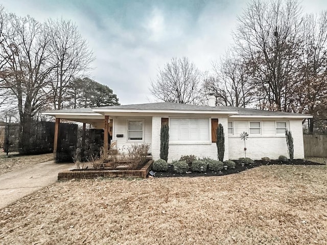 view of front of property with a carport