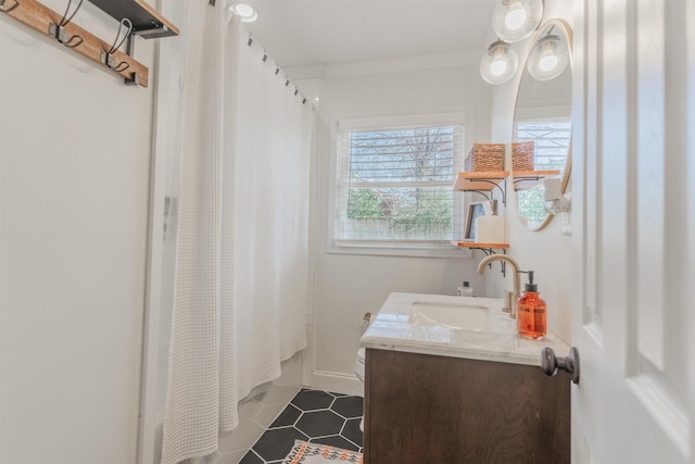 bathroom featuring vanity, shower / tub combo with curtain, and ornamental molding