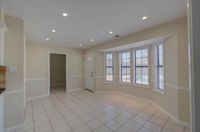 empty room with light tile patterned floors