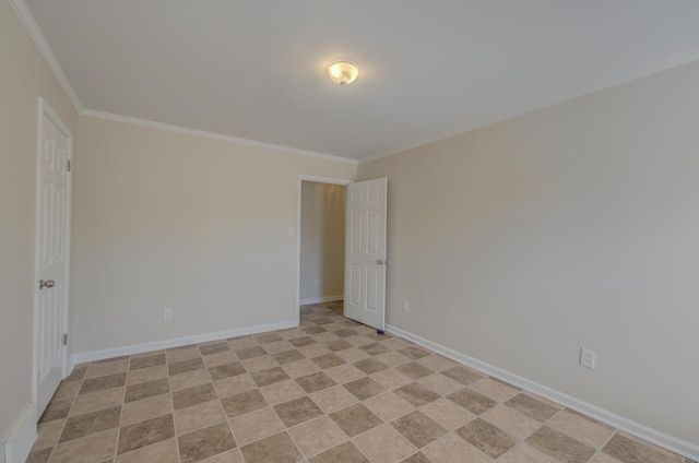 spare room with crown molding