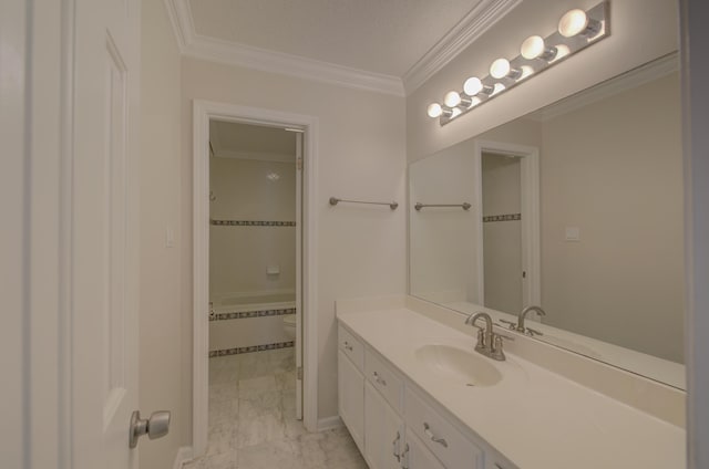 bathroom with vanity, toilet, and ornamental molding