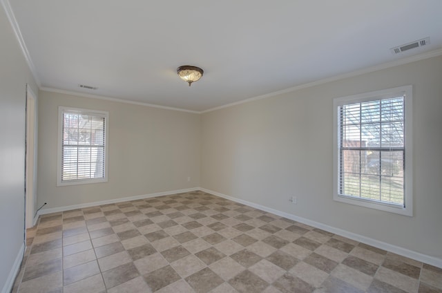 unfurnished room featuring crown molding and plenty of natural light