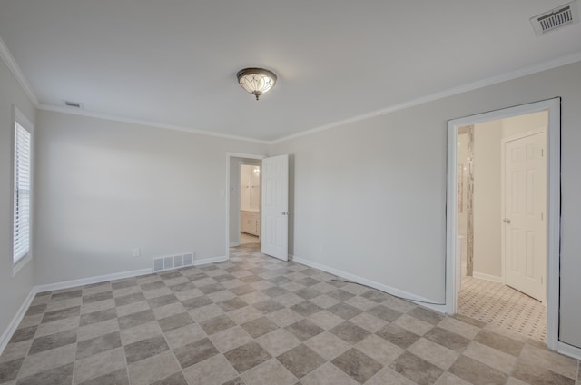 empty room featuring crown molding and a wealth of natural light