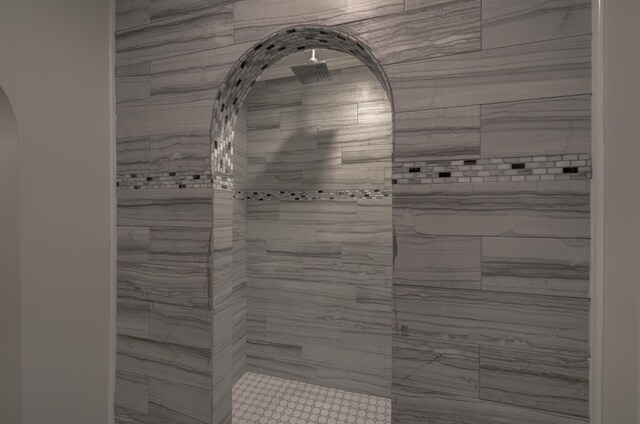 bathroom with tiled shower