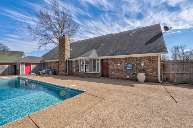 view of swimming pool featuring a patio and central AC unit