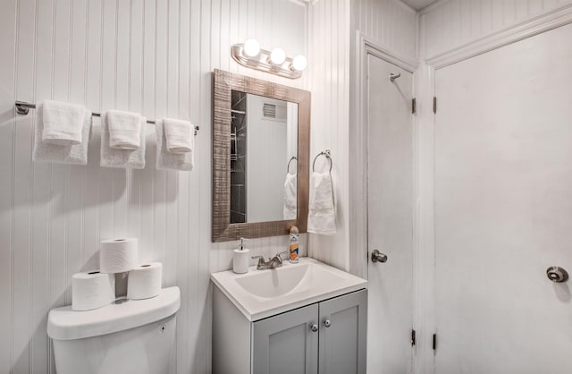 bathroom featuring vanity and toilet